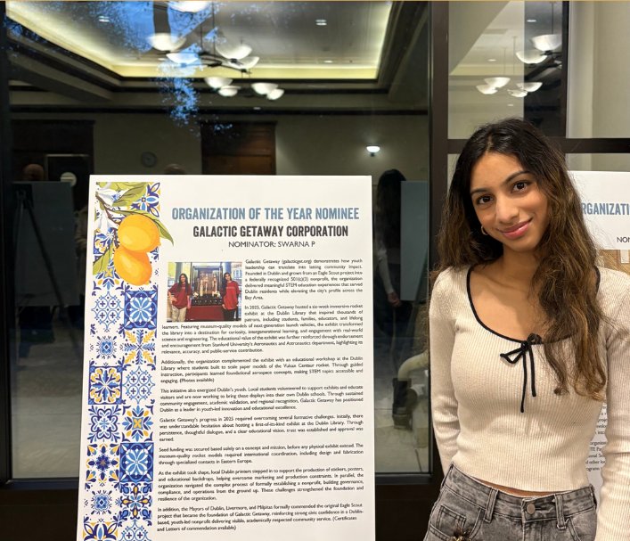 Saanvi Phaneendra with the Galactic Getaway Organization of the Year nominee poster