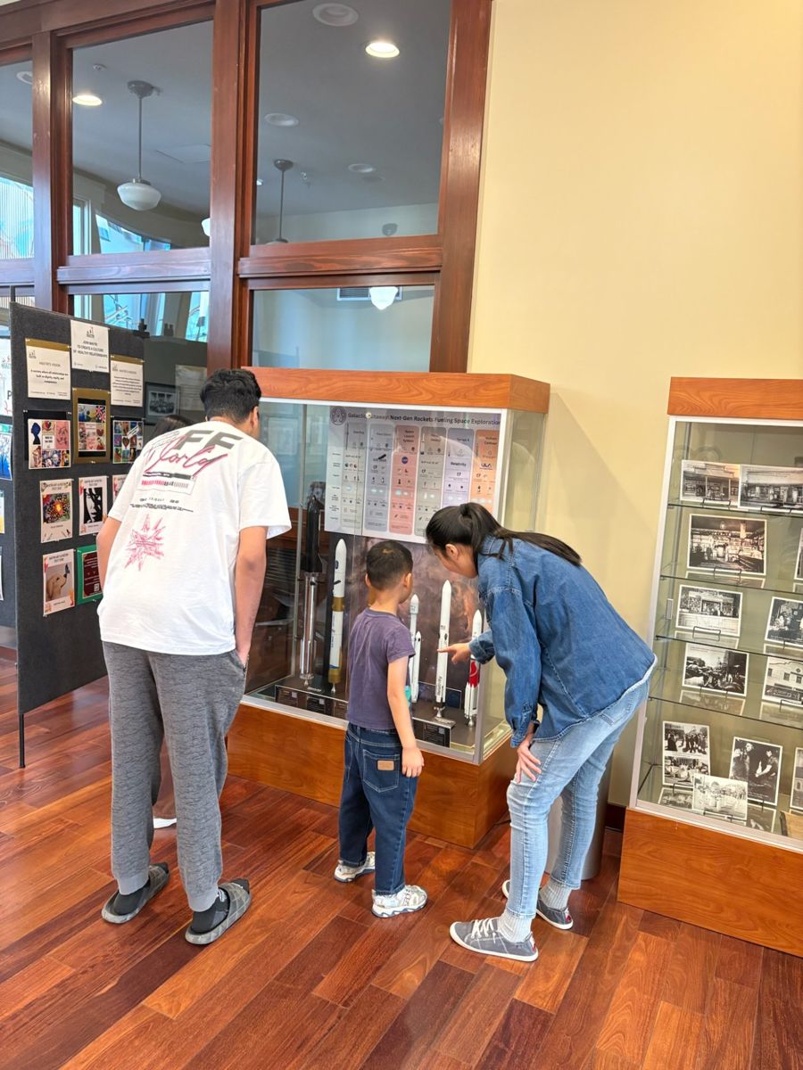 A family exploring the display