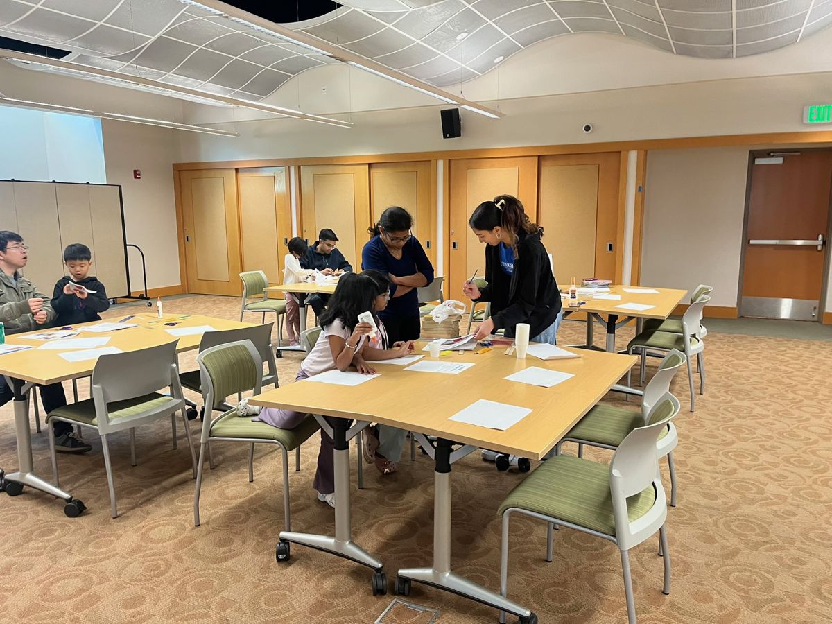 Students at a Galactic Getaway library rocket workshop