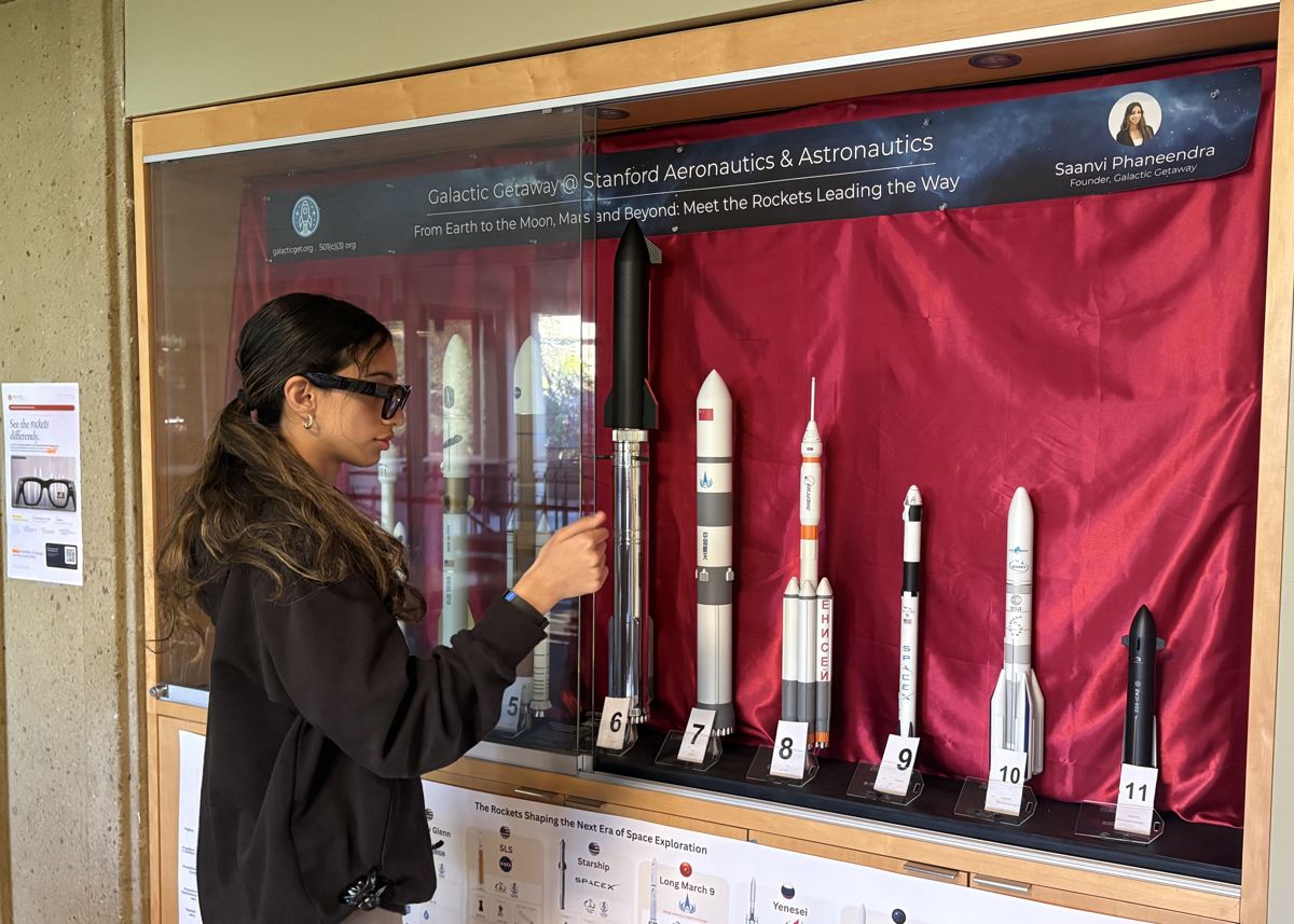 Saanvi Phaneendra using AI smart glasses at the rocket exhibit